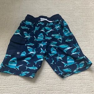 A pair of youth medium Cat & Jack swim trunks.